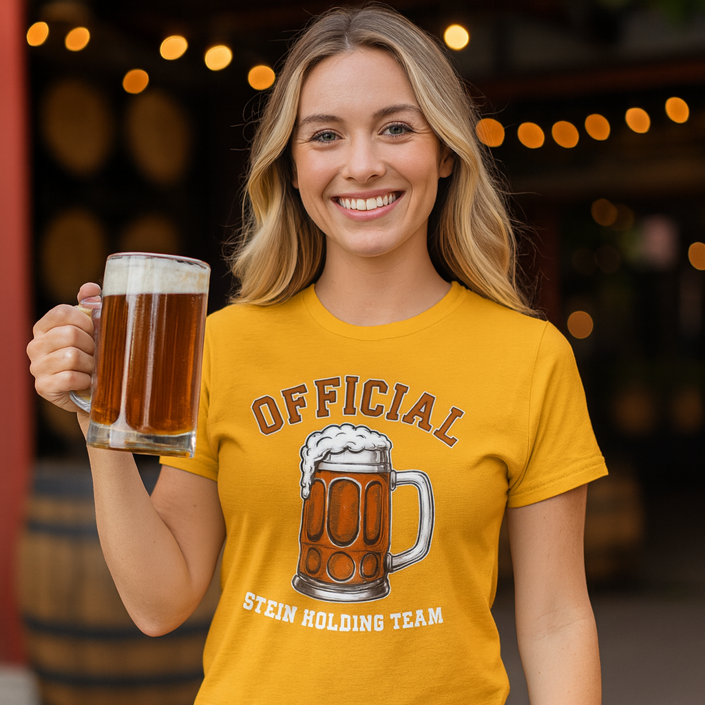 Woman wearing a yellow t-shirt with a beer graphic and text, holding a beer mug.